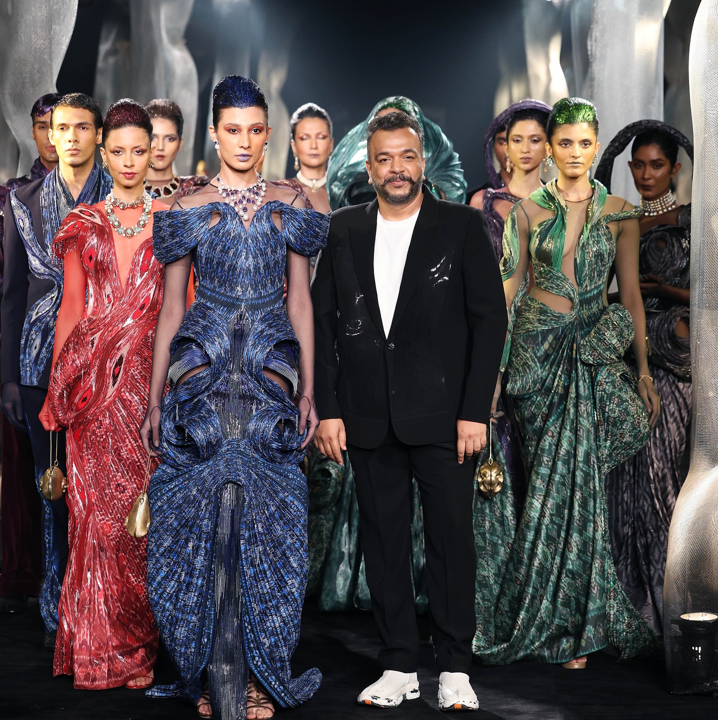 Amit Aggarwal with his models after unveiling his DNA-inspired collection, Arcanum, at India Couture Week 2025. (Image: Instagram)