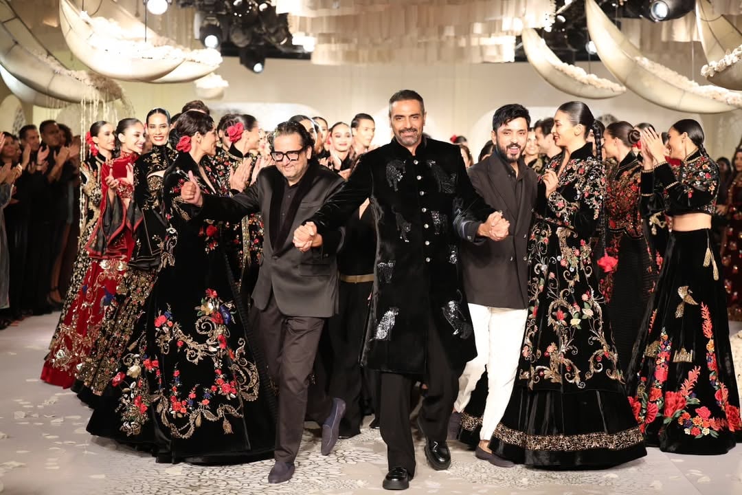 Arjun Rampal joins designers and curators on stage in a celebratory dance, echoing the joyous spirit with which Rohit Bal always ended his shows. (Image: Instagram)
