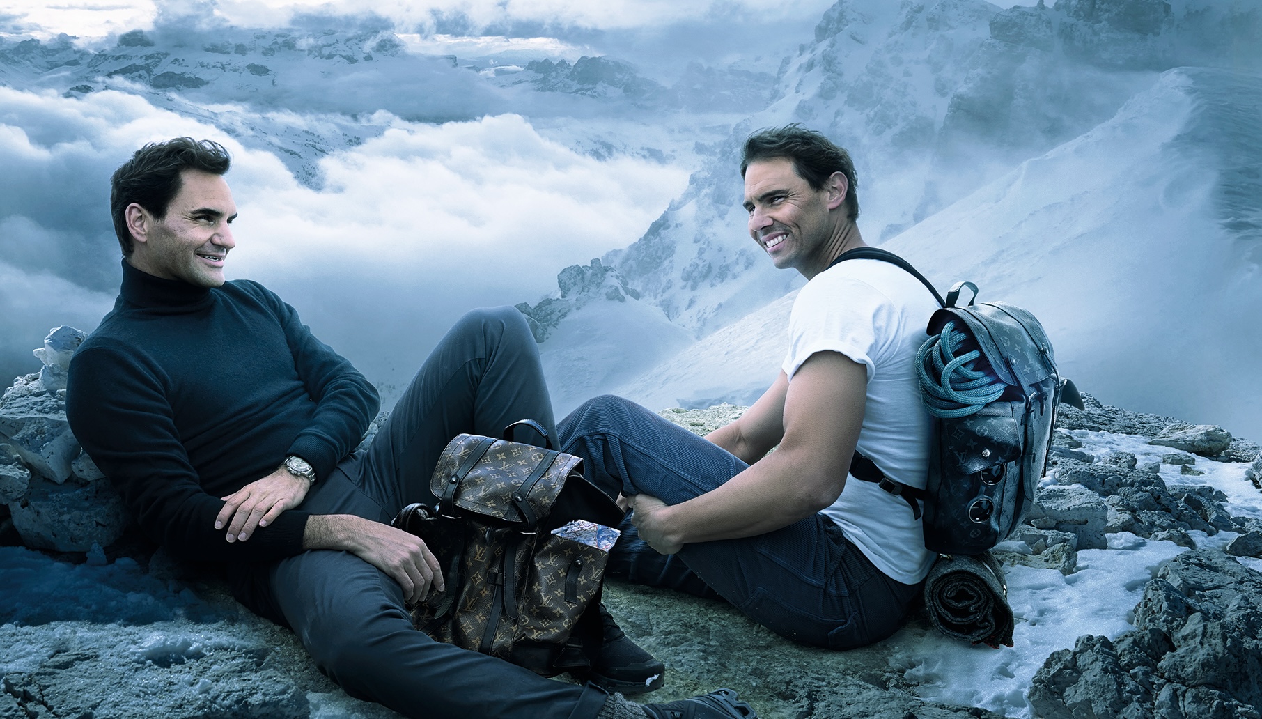 Tennis legends Roger Federer and Rafael Nadal share the spotlight in a rare Louis Vuitton campaign, posing with the house’s iconic travel trunks.