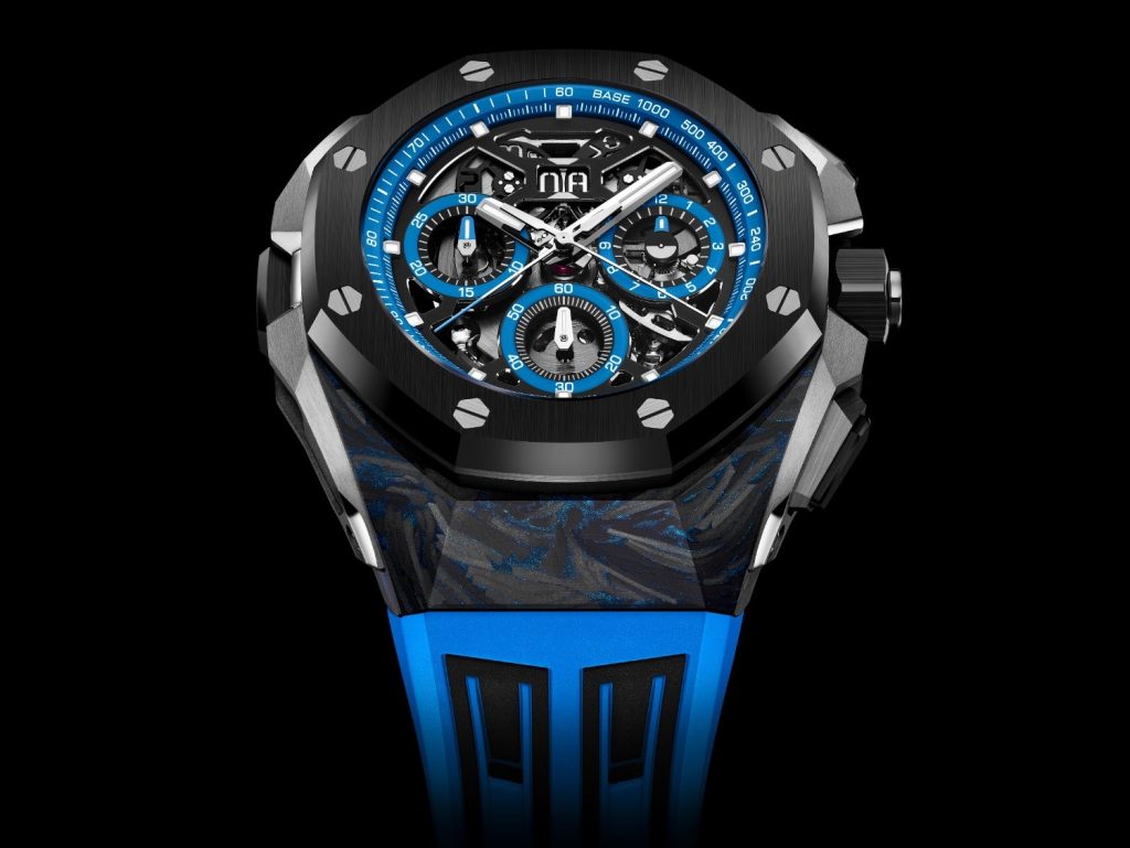 The watch’s 43 mm two-tone black-and-blue CFT carbon case has the signature Royal Oak Concept design and is enhanced with a black ceramic bezel, crown, caseback, and push pieces