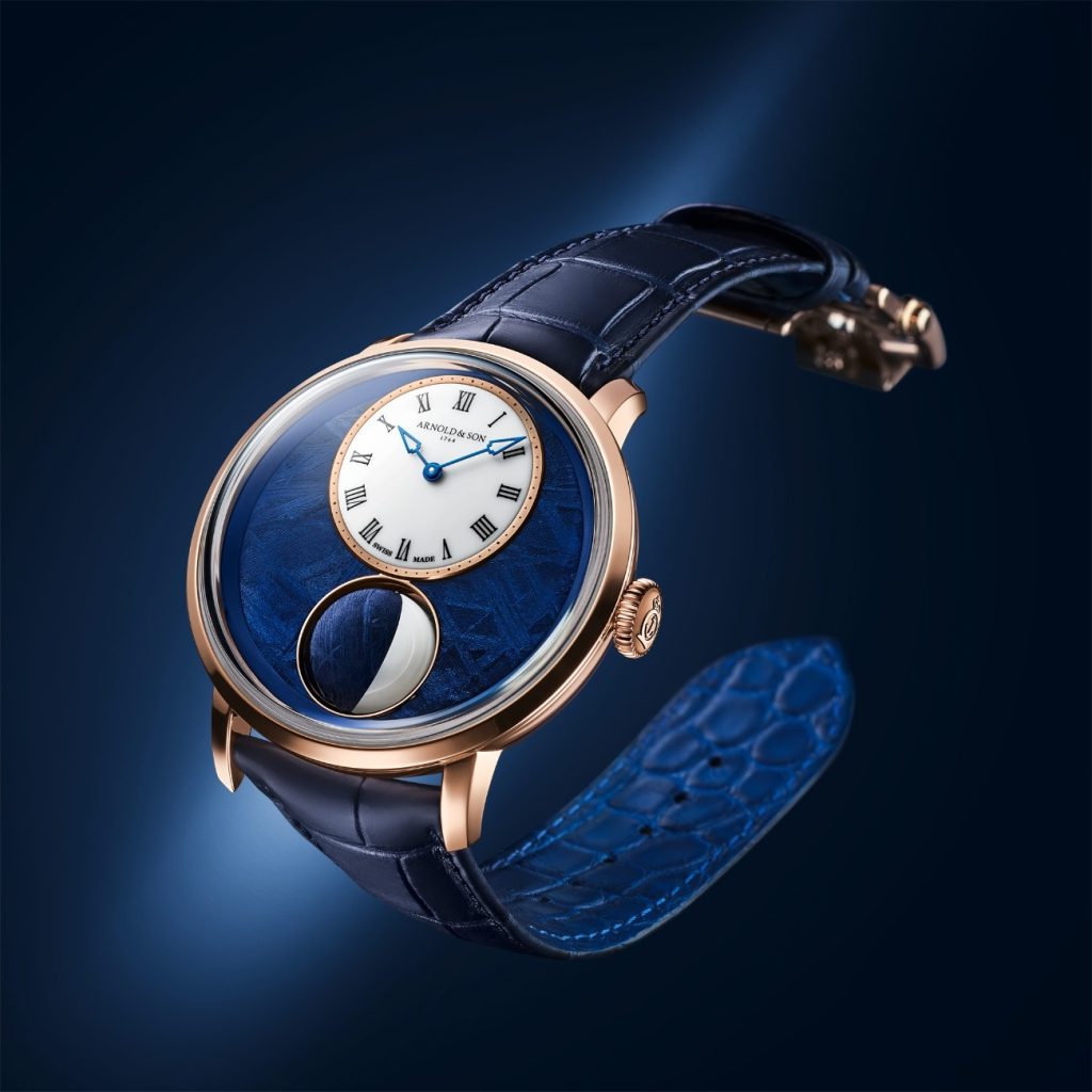 This 44mm 18K red gold gets a blue PVD-treated meteorite dial, and the subdial displays the hours and minutes has a milky, almost lunar sheen thanks to its surface in opal