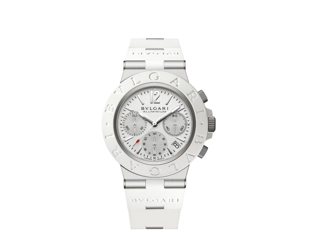 This 40mm novelty has a sandblasted aluminium case, paired with a white rubber bezel, engraved with "BVLGARI BVLGARI", and a sandblasted titanium crown positioned at 3 o’clock