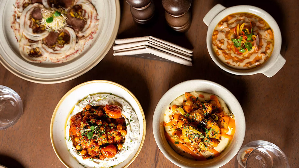 Food spread at Dar Tantora The House Hotel, Dar Tantora The House Hotel sustainable tourism Saudi Arabia, Saudi Arabia traditional house hotel Dar Tantora The House Hotel, AlUla heritage hotel Saudi Arabia Dar Tantora The House Hotel,