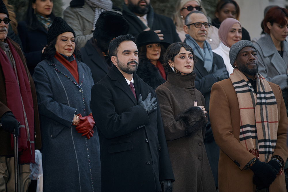 Mayor Zohran Mamdani, center left, and his wife, Rama Duwaji, center right, stand during the national anthem, Zohran Mamdani first Muslim mayor, Zohran Mamdani youngest NYC mayor, Zohran Mamdani subway oath, Zohran Mamdani finances, Zohran Mamdani wealth,