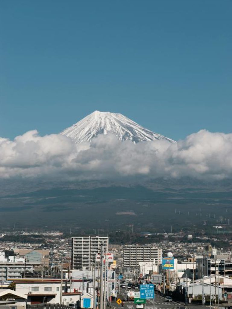 City Of Shizuoka With Mount Fuji Shrouded In Clouds In The Background (Reference Picture), mount fuji in japan, mt fuji view in japan, why should we visit mt fuji,how to go to mt fuji