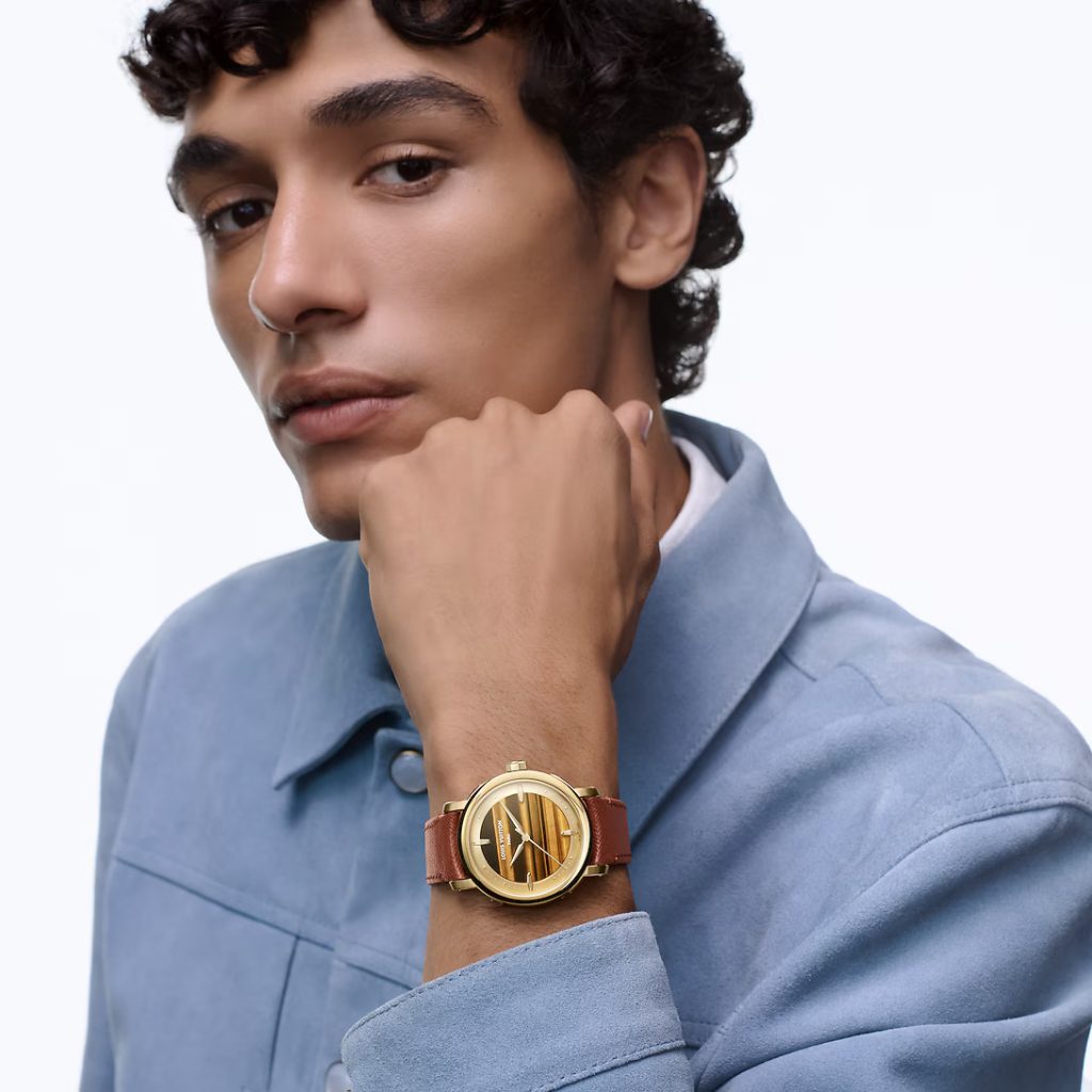 This 40mm yellow gold and tiger’s eye is a striking fusion of artistry, innovation, and elegance