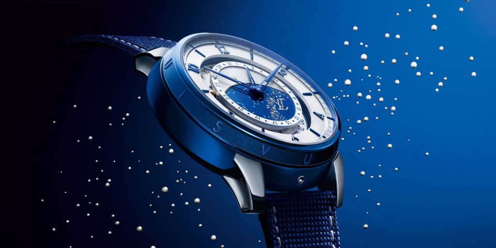 At first glance, the watch announces its presence through a Tambour Taiko shaped case rendered in blued titanium