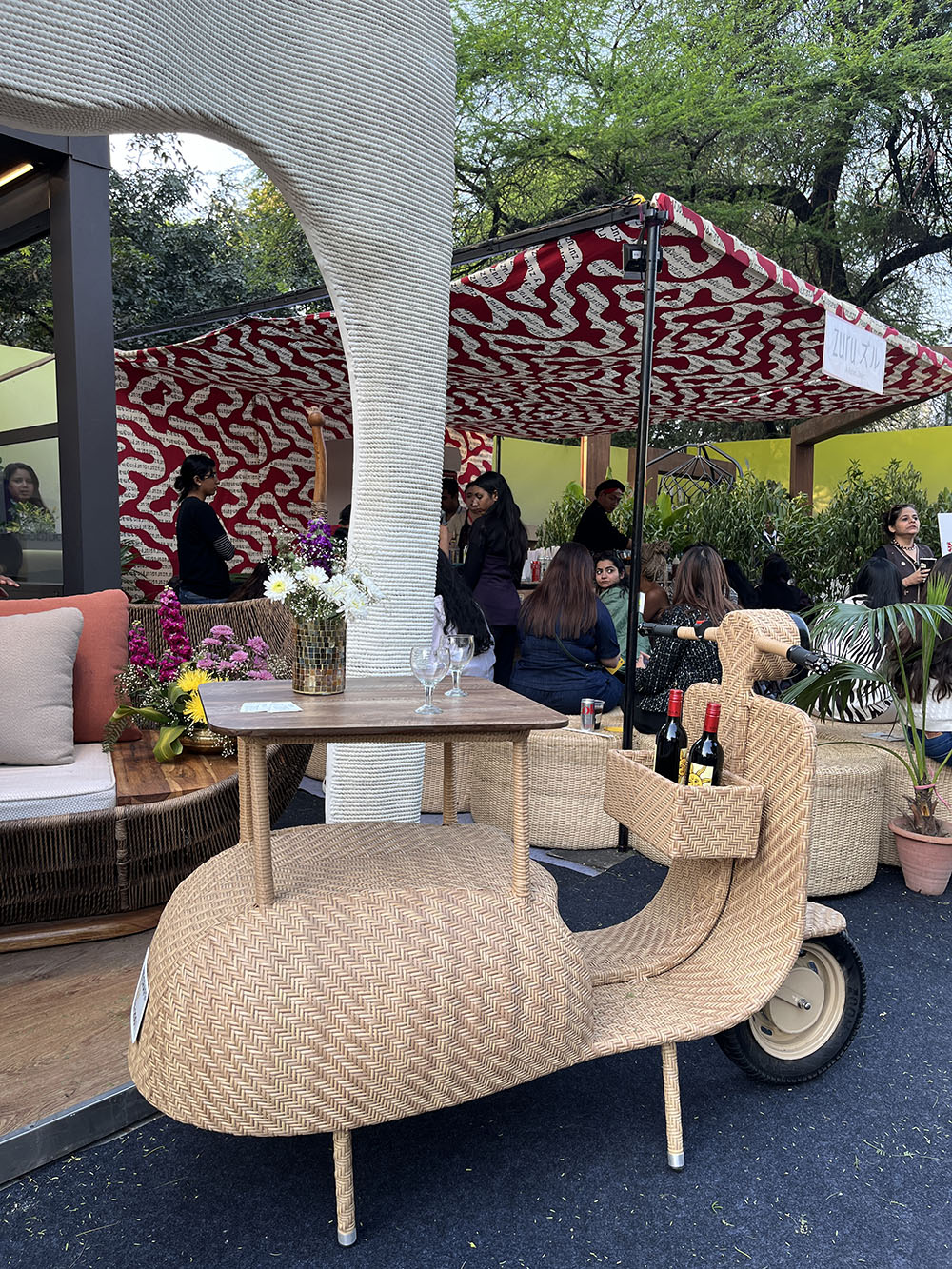 A scooty-shaped wine bottle holder crafted with wicker, best to be stationed in patio by Delhi-based furniture brand Weave Craft.