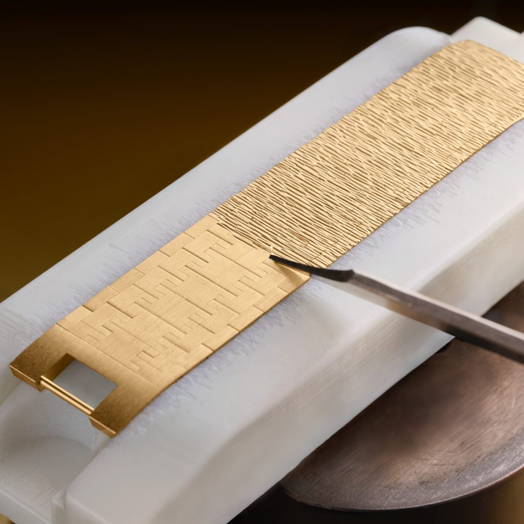 Drawing inspiration from traditional guilloché dial work, Piaget devised its own hand