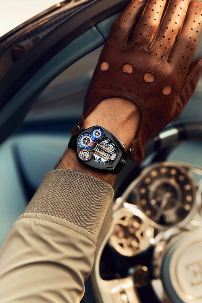 This timepiece has a black PVD titanium case that echoes the car’s assertive grille