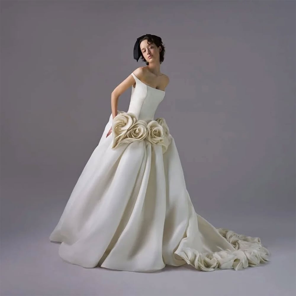 An off-the-shoulder light ivory silk gazar ballgown by Vera Wang, zendaya engagement ring, all details about zendaya and tom holland's secret wedding