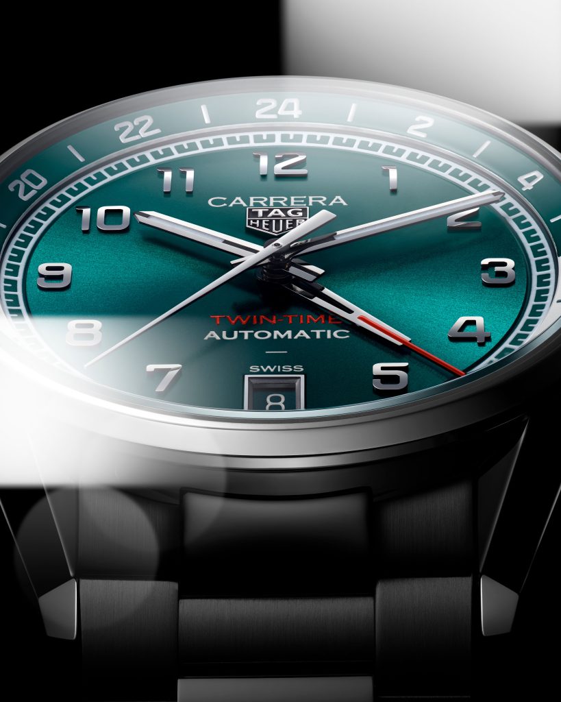 This 41mm stainless steel watch has a teal and silver 24-hour scale, and a more pronounced teal and silver seconds/minutes track