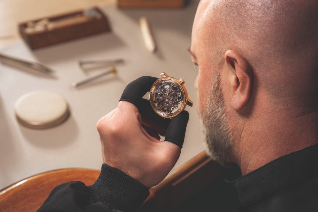 At 6 o’clock, the lyre shaped tourbillon cage performs its perpetual ballet, doubling as a small seconds display