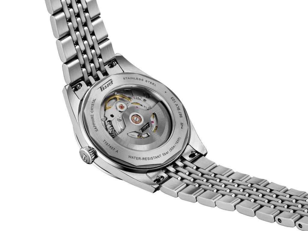 Turn the watch over, and a transparent caseback reveals the considered mechanics within, where the Powermatic 80 movement