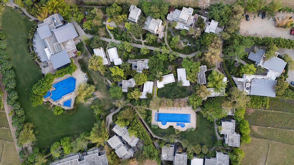 resort architecture in natural landscape, eco tourism hospitality design, green resort architecture, nature-inspired resort architecture, eco tourism resort architecture in forest areas, 