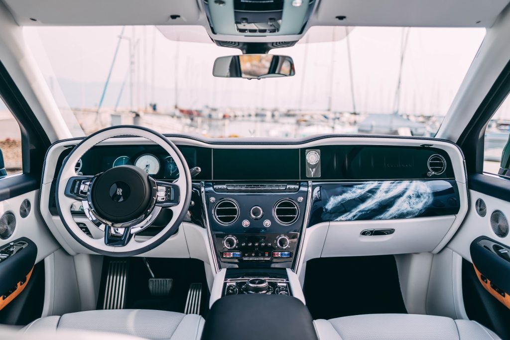 Within, the cabin reveals itself as a sanctuary of nautical refinement. Arctic White and Navy Blue leather envelop the interior,