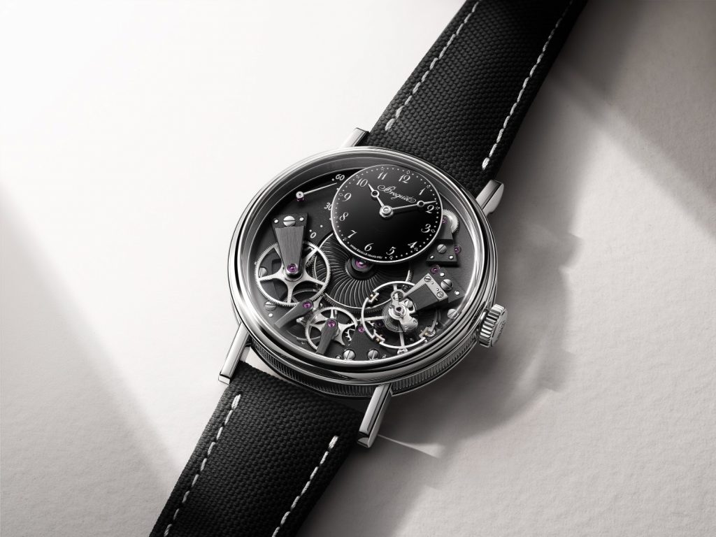 The next model is also sized at 38mm with a platinum case, welded lugs, and a crown at 3 o'clock. The only difference remains it has a black movement and black Grand Feu enamel dial with white Arabic hour markers