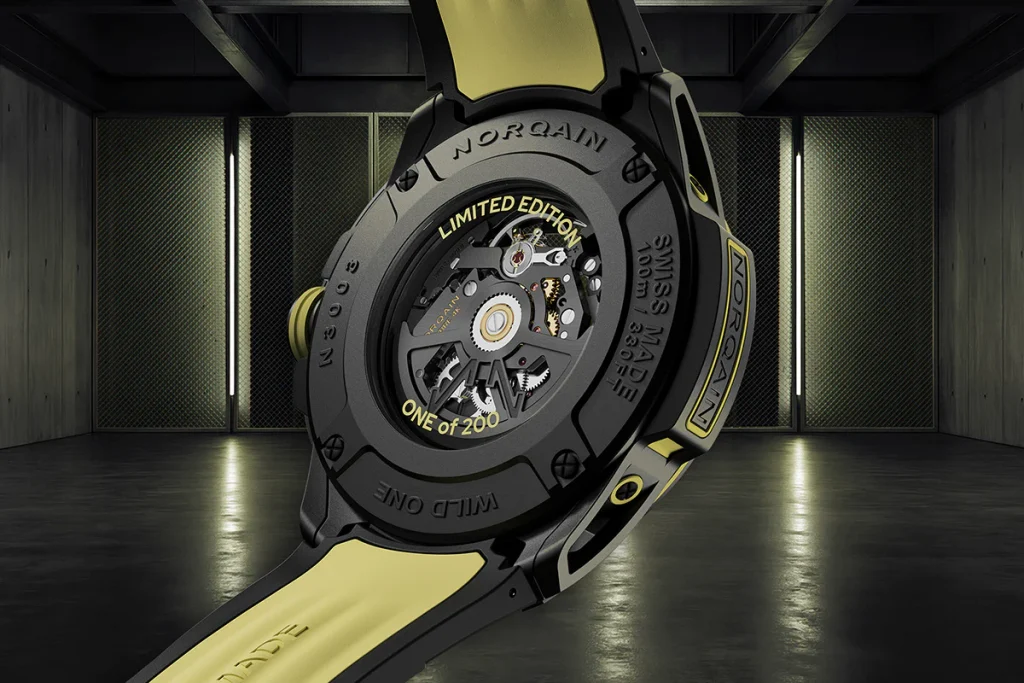 The open caseback, secured with four visible screws and protected by scratch proof sapphire crystal