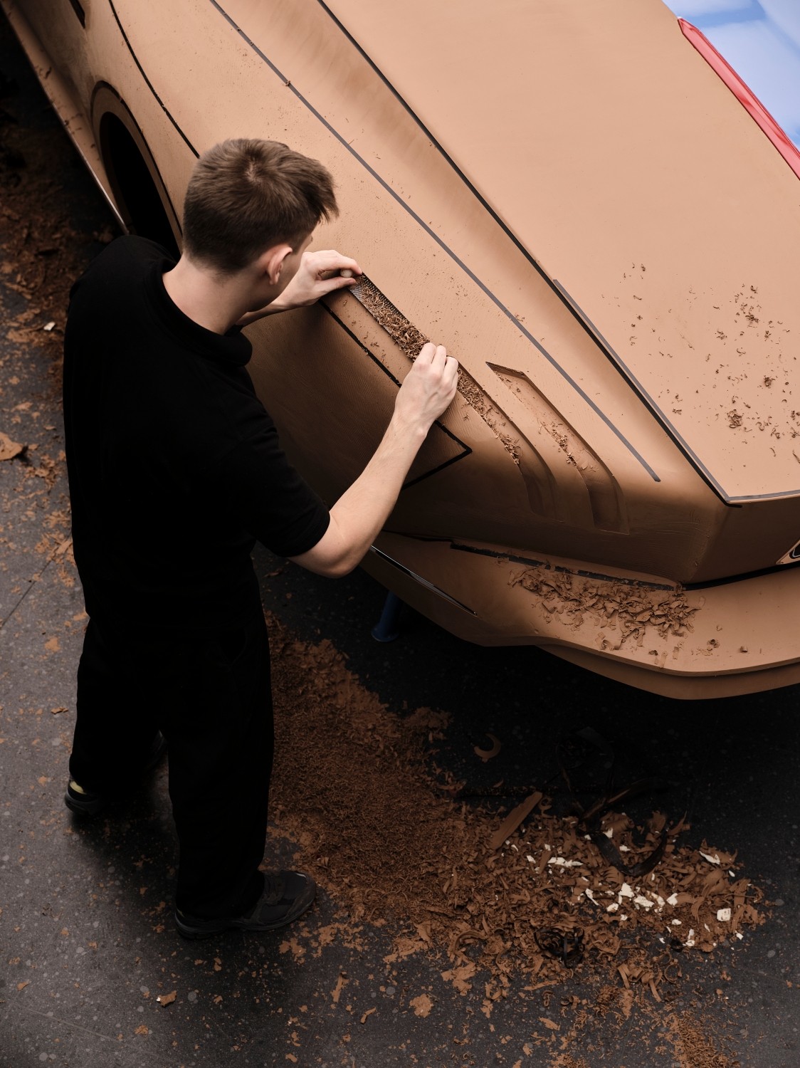 There are no unnecessary openings, no clutter, no visual noise. The absence of a traditional combustion engine