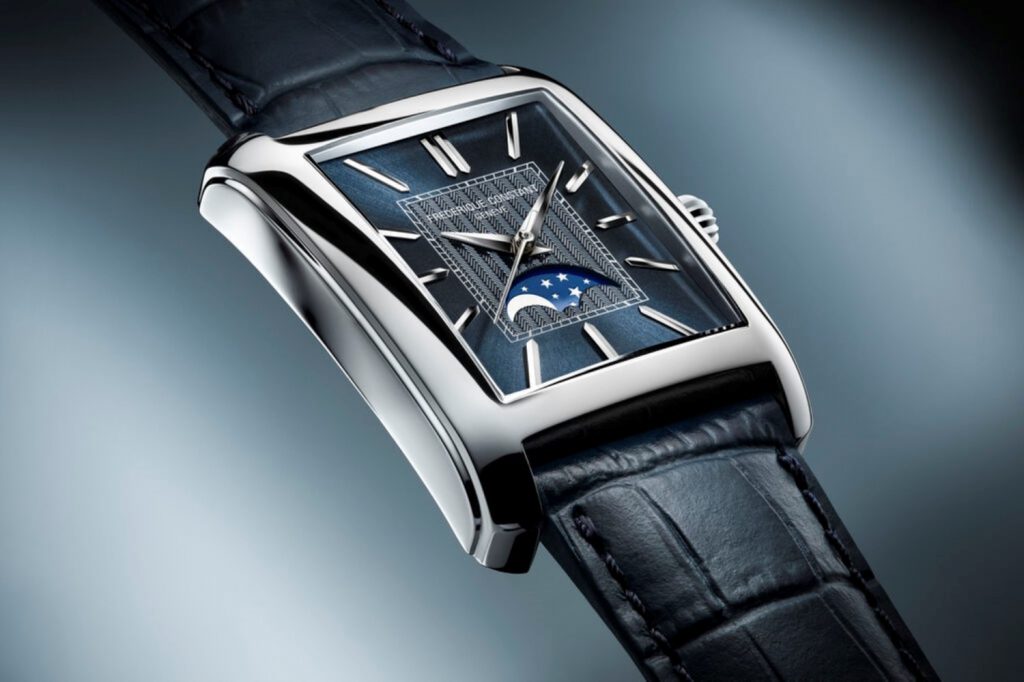 The novelty features a polished stainless steel rectangular case measuring
