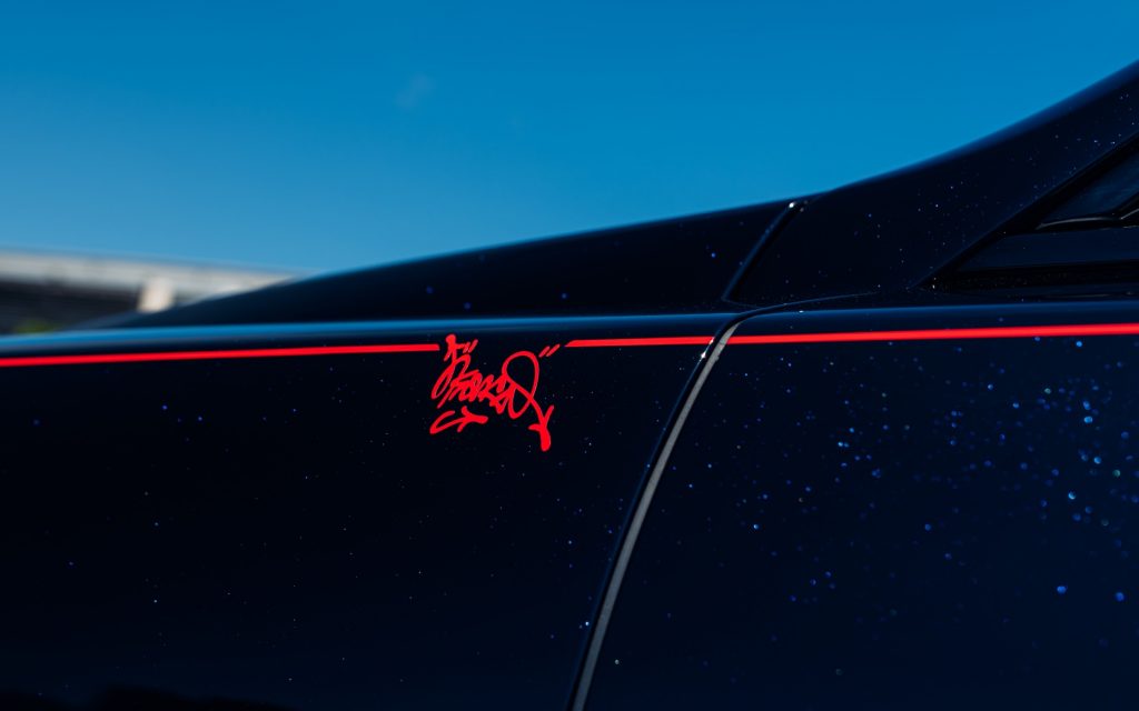 Outside, the car wears a rich Blue Crystal Over Black finish