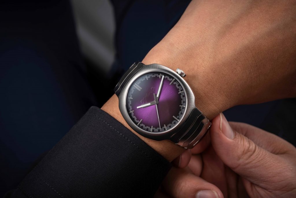 The timepiece has a 40 mm stainless steel case defined by flowing, ergonomic lines