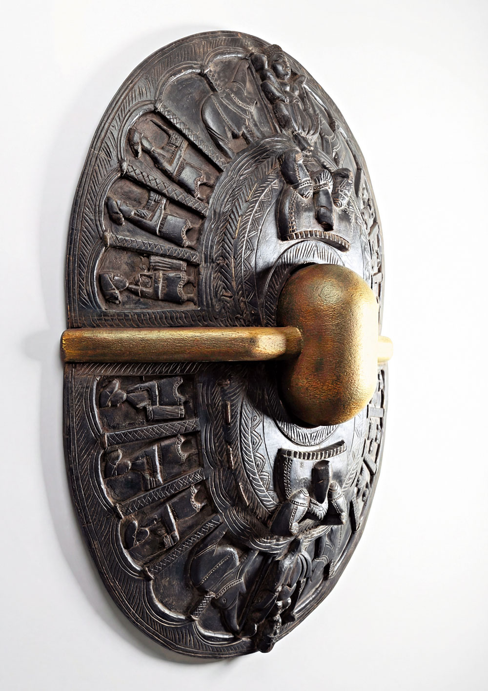 Poothan forms unite, holding a brass core of balance and continuity.