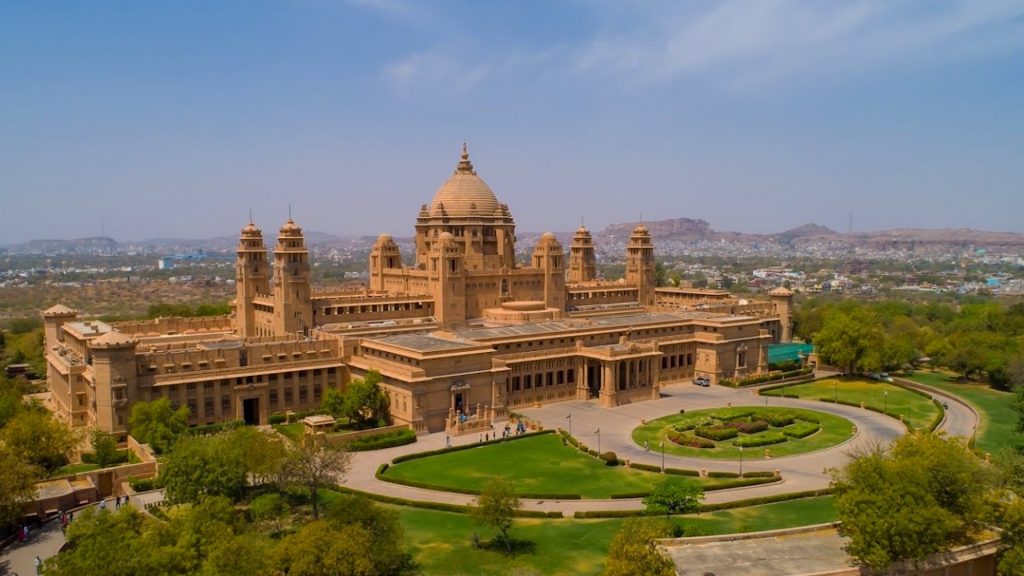 Rising above the blue city of Jodhpur like a sandstone mirage, Umaid Bhawan Palace