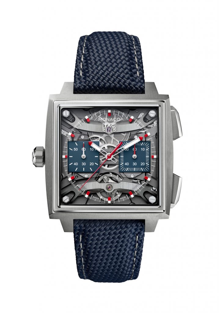 The 40mm Grade 5 titanium case feels wonderfully modern, while the open-worked hands and transparent
