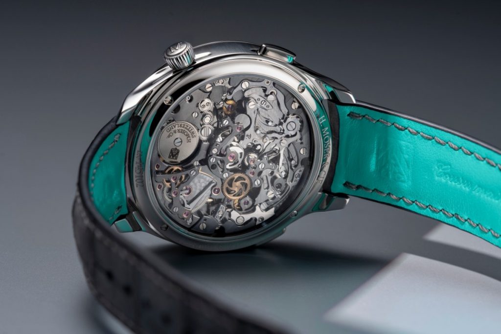 Viewed through the sapphire caseback, the calibre showcases anthracite finishing