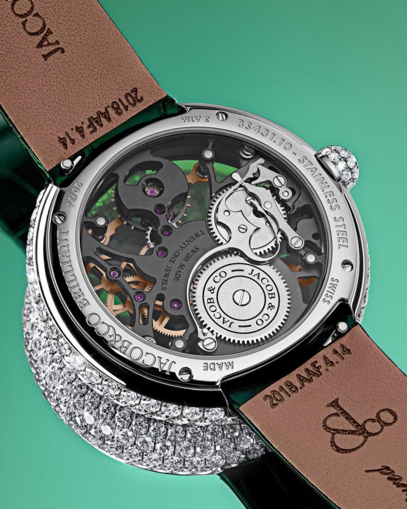 The timepiece is completed with a satin strap paired with a stainless steel tang buckle