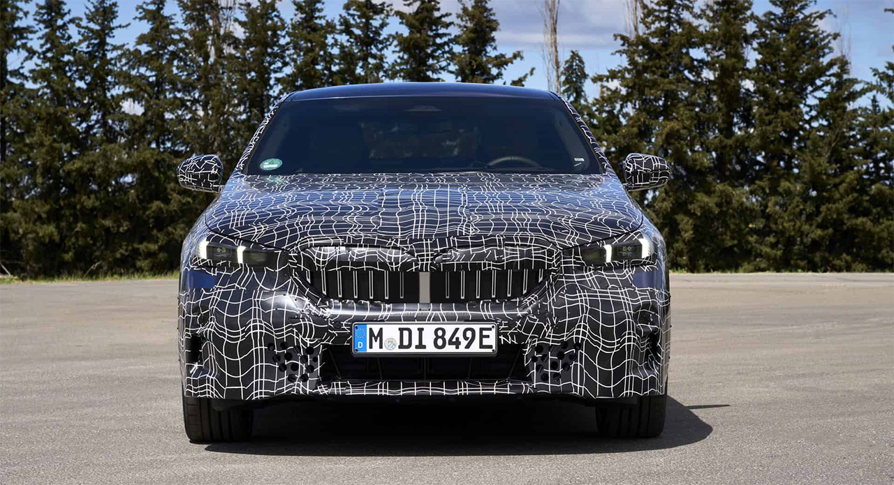Those bizarre black and white wraps are not there for style. They are carefully engineered disguises that protect years of design, engineering and millions in research before a new car finally reaches the public