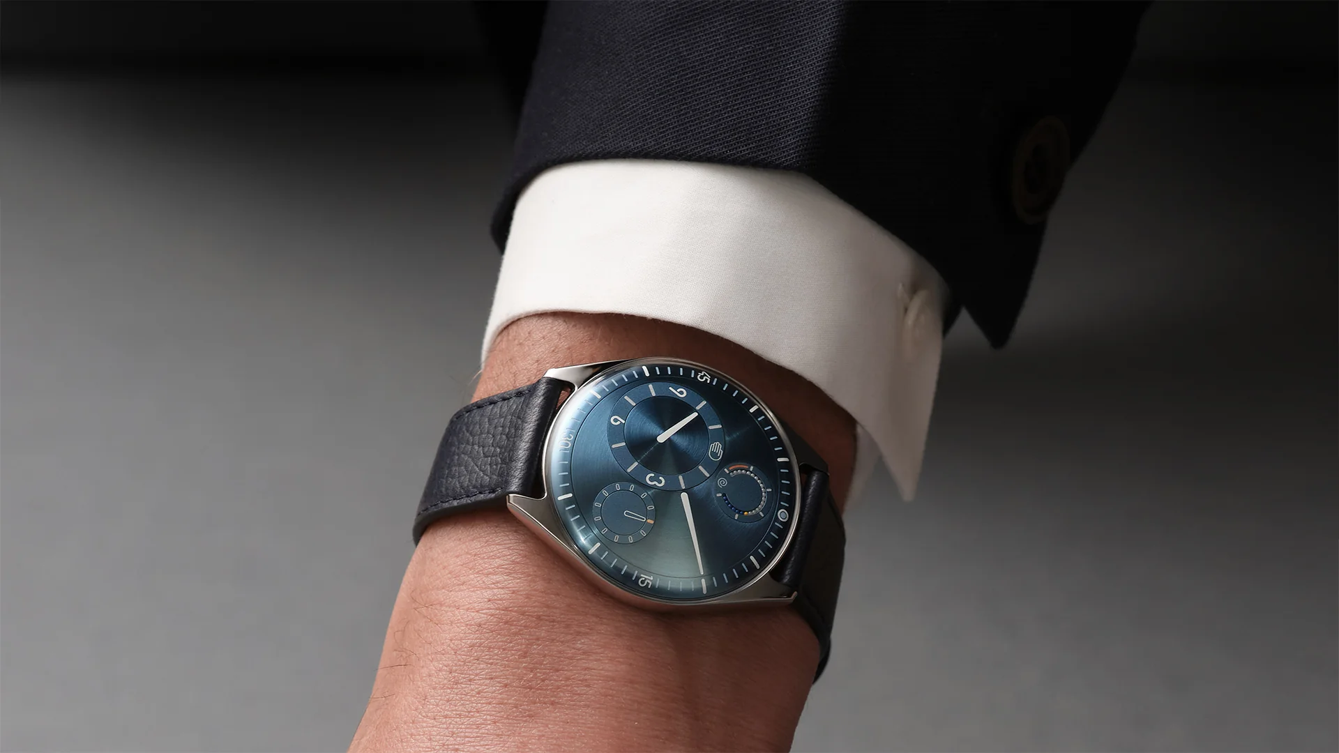 Measuring 41mm, and crafted from Grade 5 titanium, this timepiece features a smooth pebble