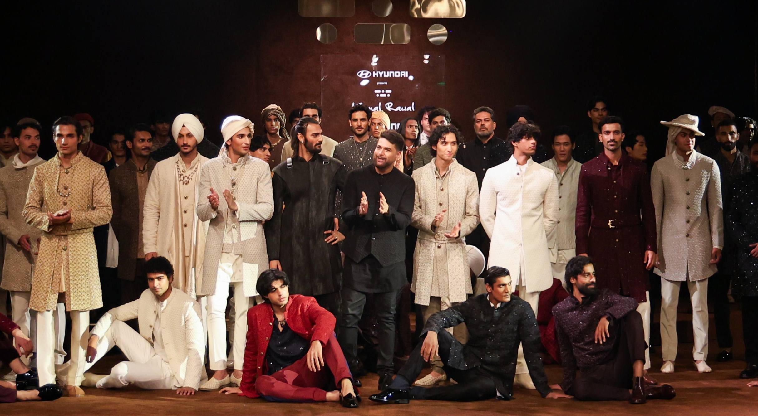 The experience begins long before the first model steps onto the runway. Opening with a dramatic monologue