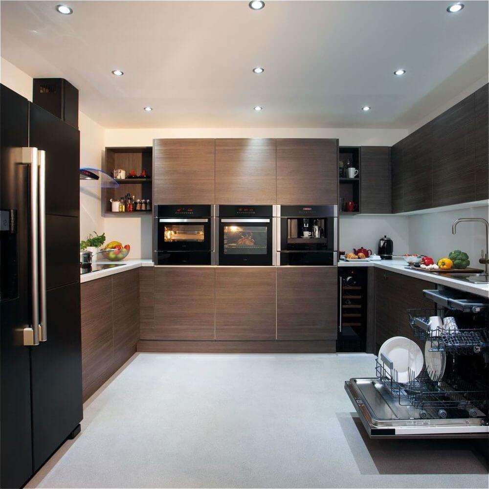 There was a time when hiding your refrigerator behind matching cabinetry was a rather extravagant way of saying you had money