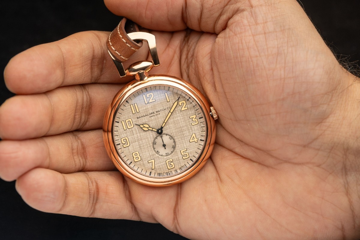 The specification sheet does not detail a separate lug construction, with the watch instead paired to a lanyard style genuine leather strap
