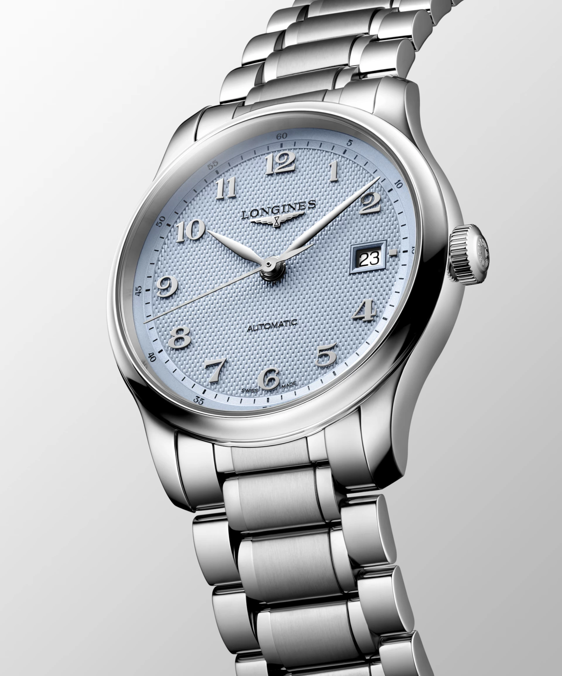 The 39mm stainless steel case gives this light blue watch a refined, versatile presence, while its “barleycorn” dial