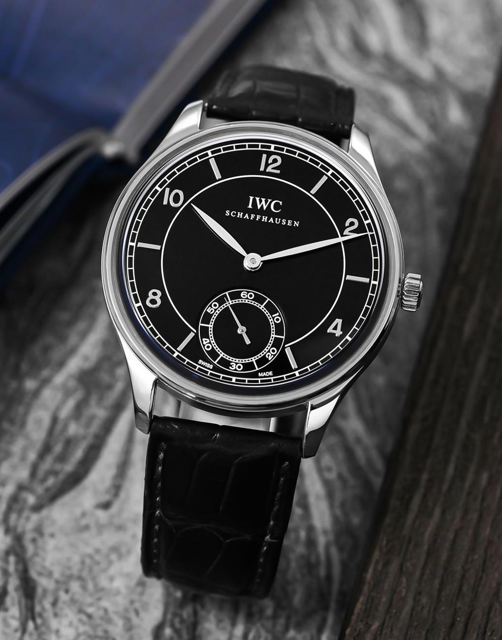 IWC Portugieser (vintage-inspired). Three years after Patek's revival, IWC added a sector dial to its Portuguese