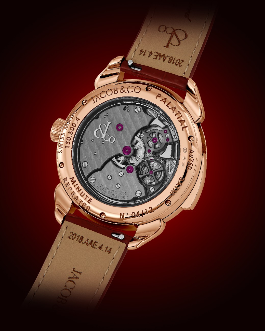 The watch is presented on a red alligator strap secured with a matching rose gold