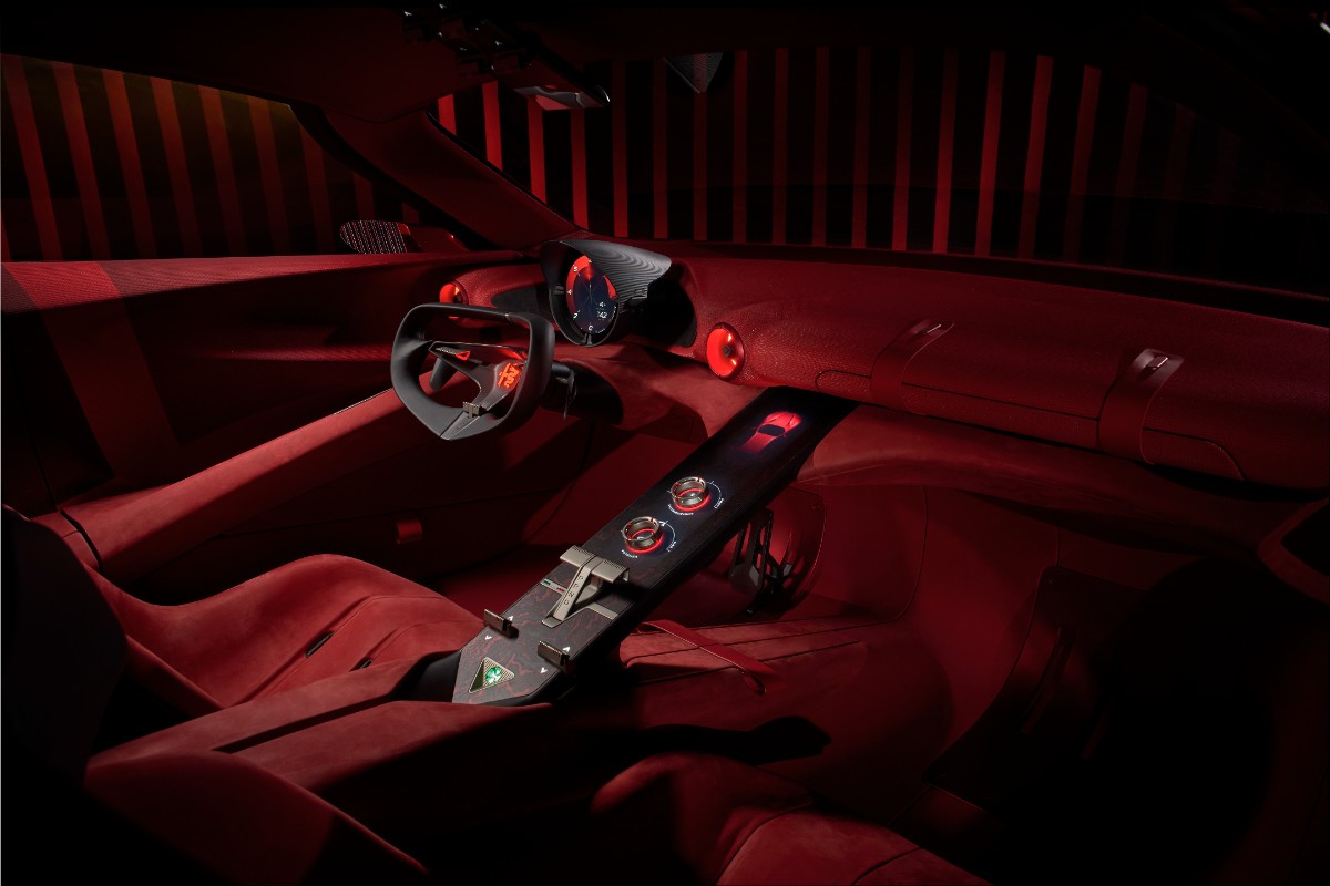 Inside, the theatrics continue. There’s a steering wheel reinterpreted through steer-by-wire technology