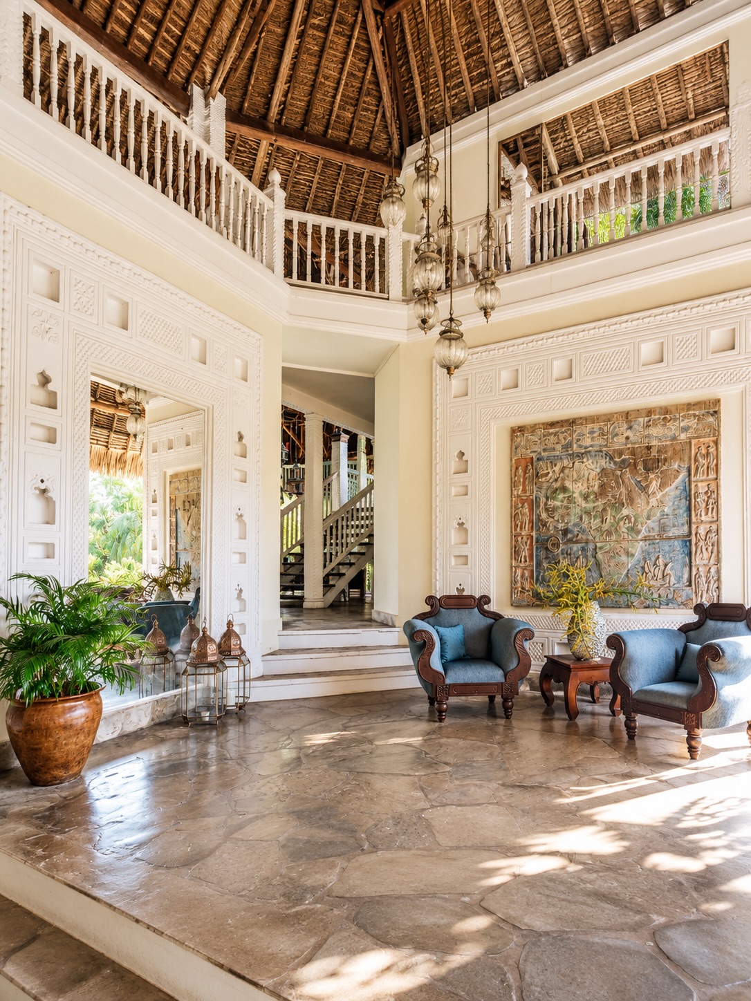 The mood is set by the details of daily living. White curtains catch the breeze, shaded terraces invite long lunches